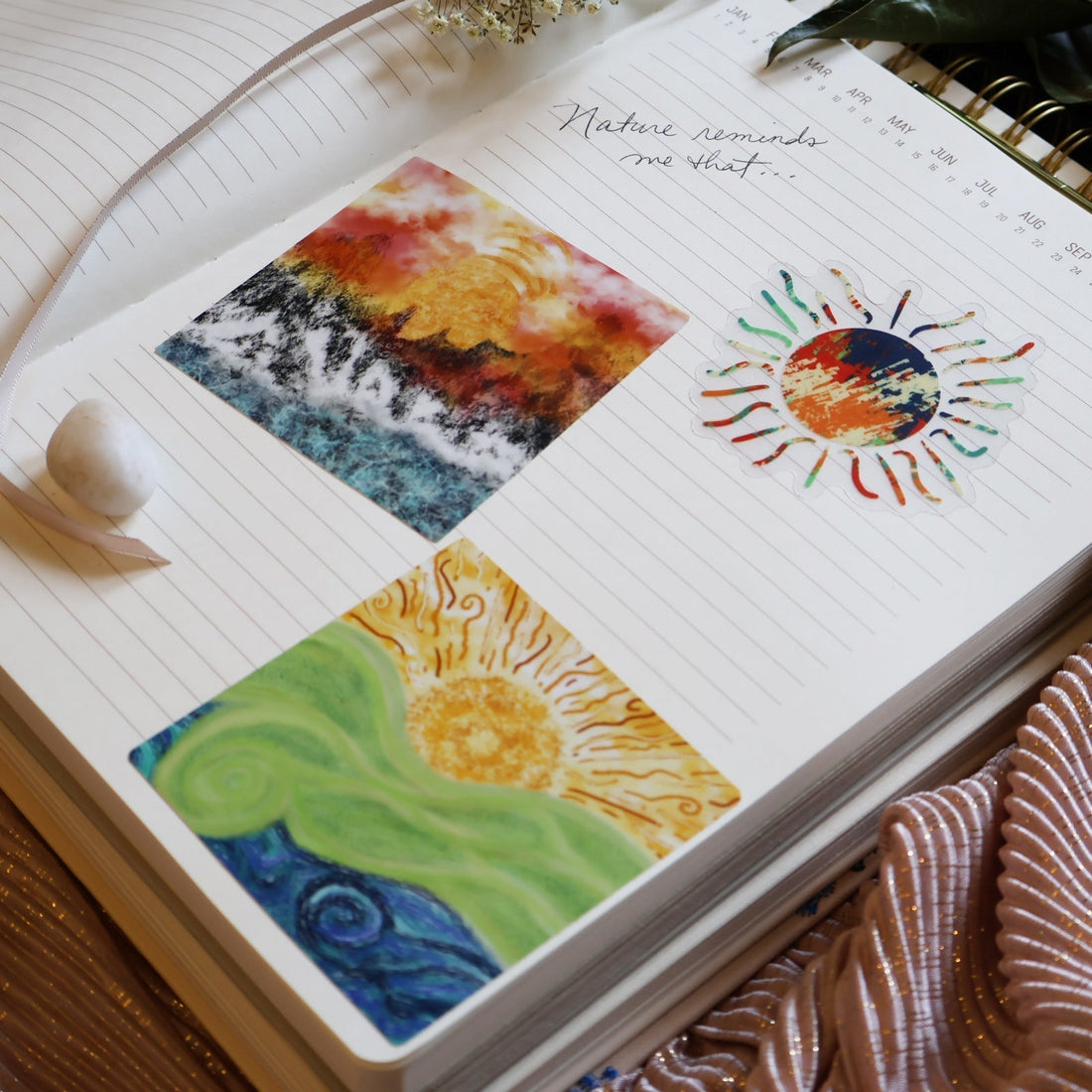 Open journal page decorated with SLChristley Designs Sunlit Spiral Flow, Abstract Horizons Sun, and Sunrise stickers.