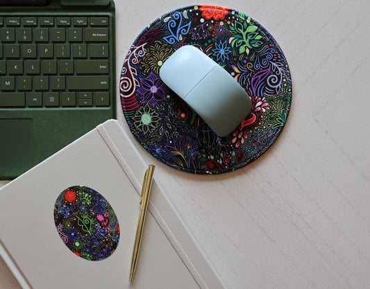 SLChristley Designs Floral Fantasy mousepad and matching sticker styled with a journal, laptop, and pen on a table.