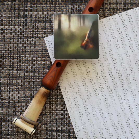 Music sheet with a duduk instrument and a SLChristley Designs violin sticker.